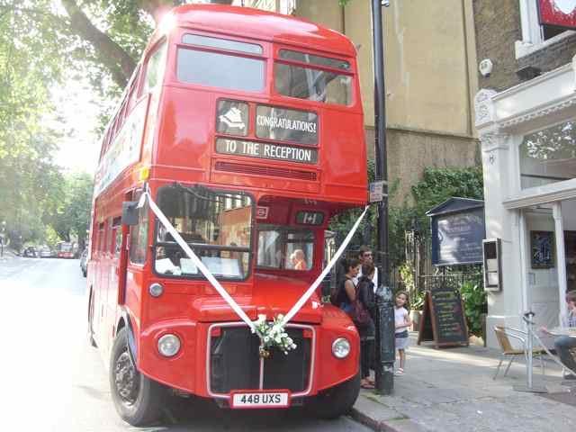 The Routemaster parked outside a church.